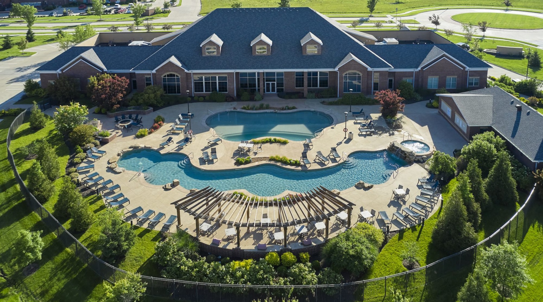 Aerial view of a pool and clubhouse