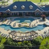 Aerial view of a pool and clubhouse