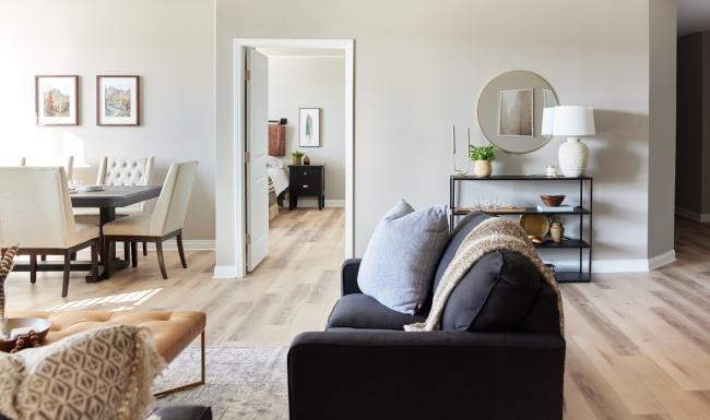 a living room with a black couch