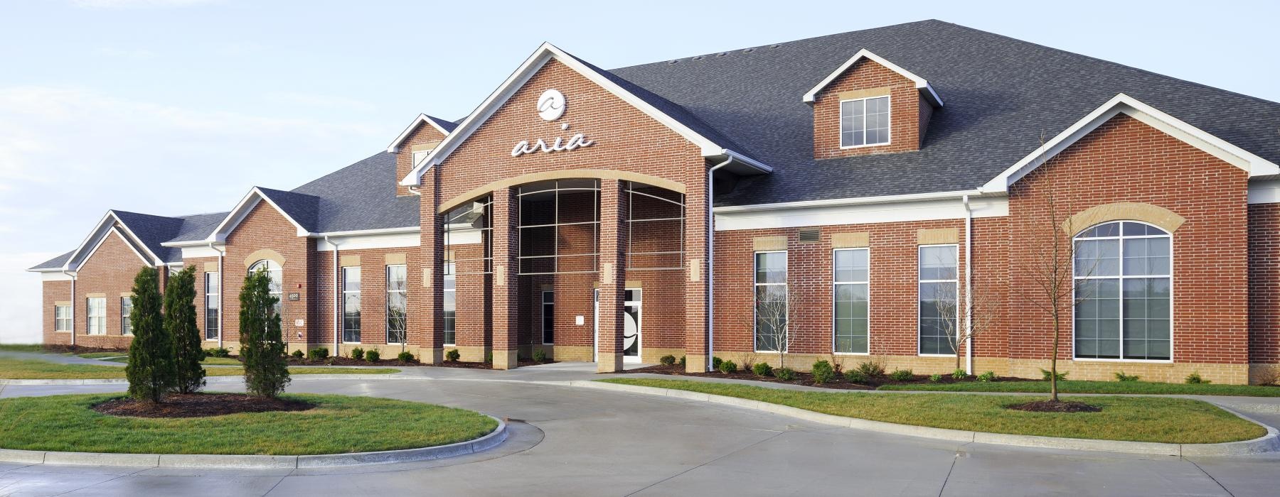 a brick building with a driveway